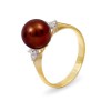 Ring from 14 karat gold with natural pearls and diamonds